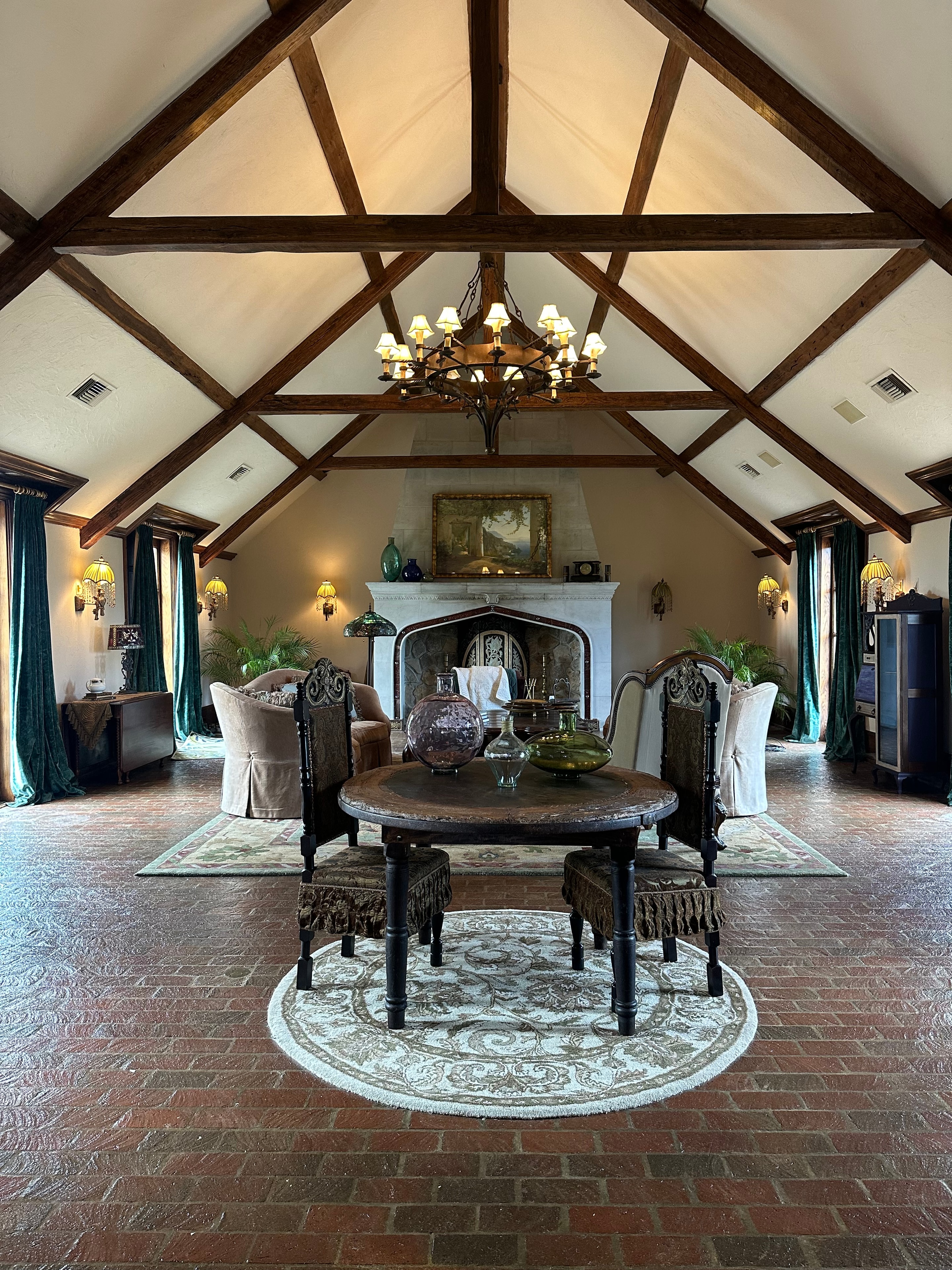 Tudor-style dining room with exposed beams and chandelier
